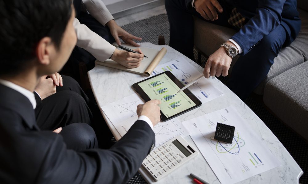 business-people-working-with-ipad-high-angle